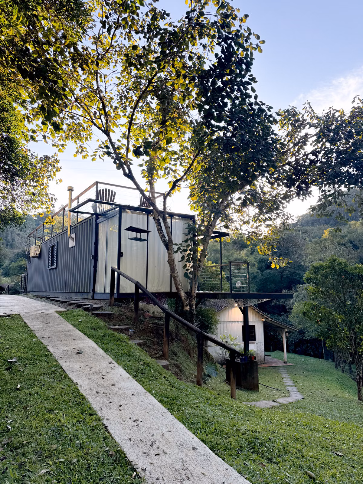 Modern home built into a wooded hillside
