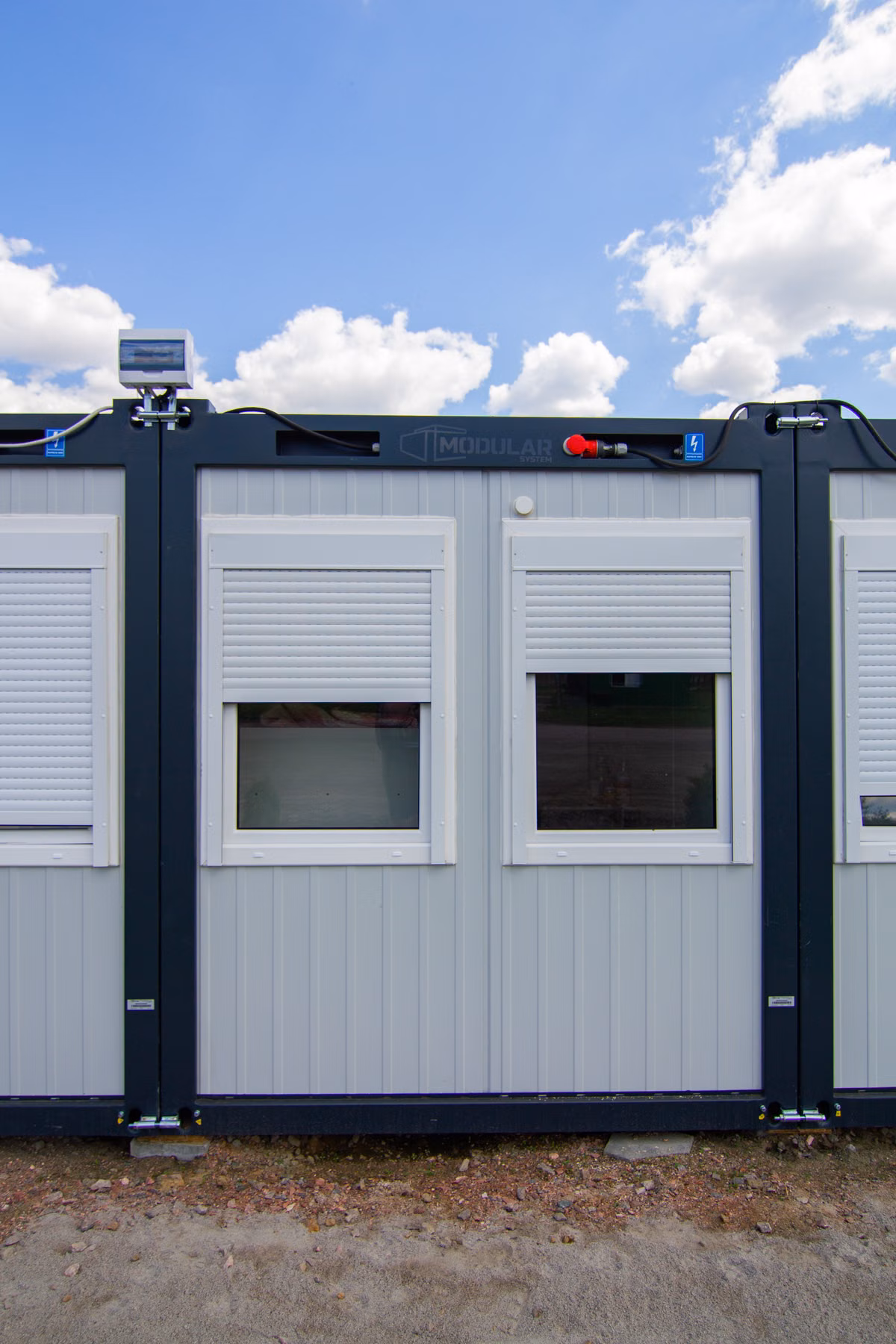 Row of compact modern dwellings in an open landscape